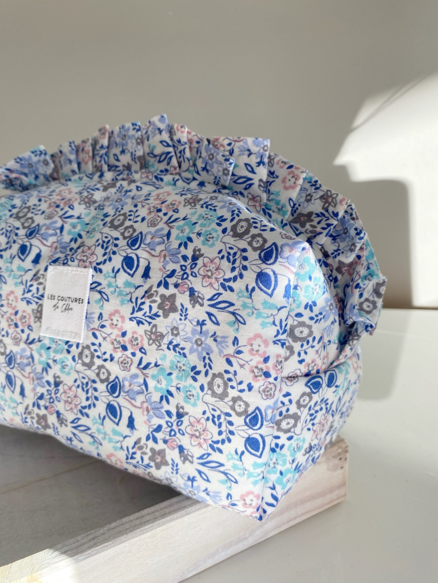 Trousse de toilette à volants