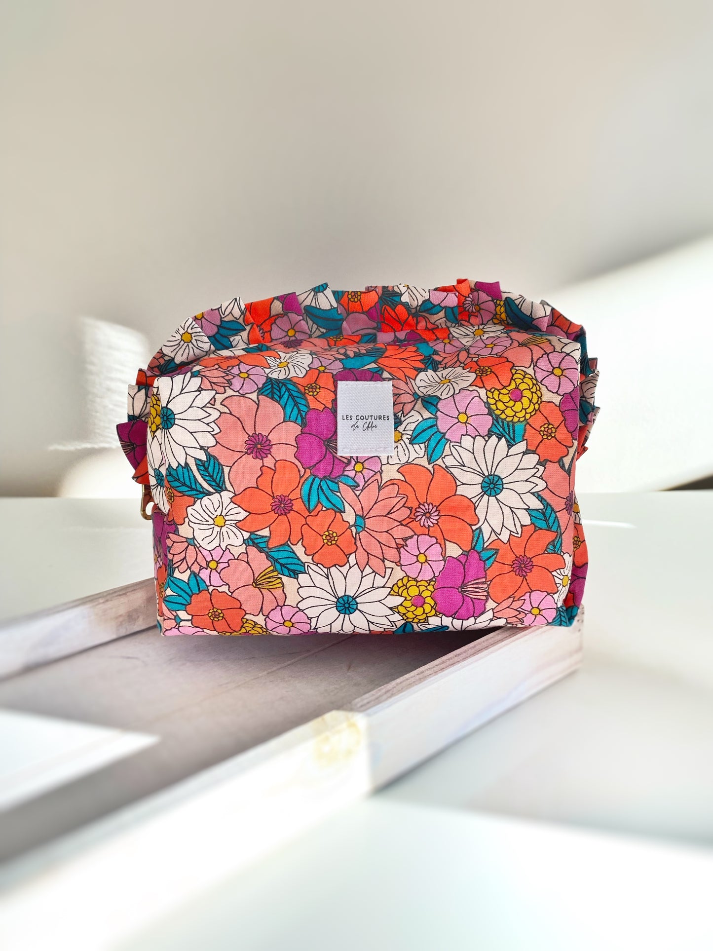 Trousse de toilette à volants