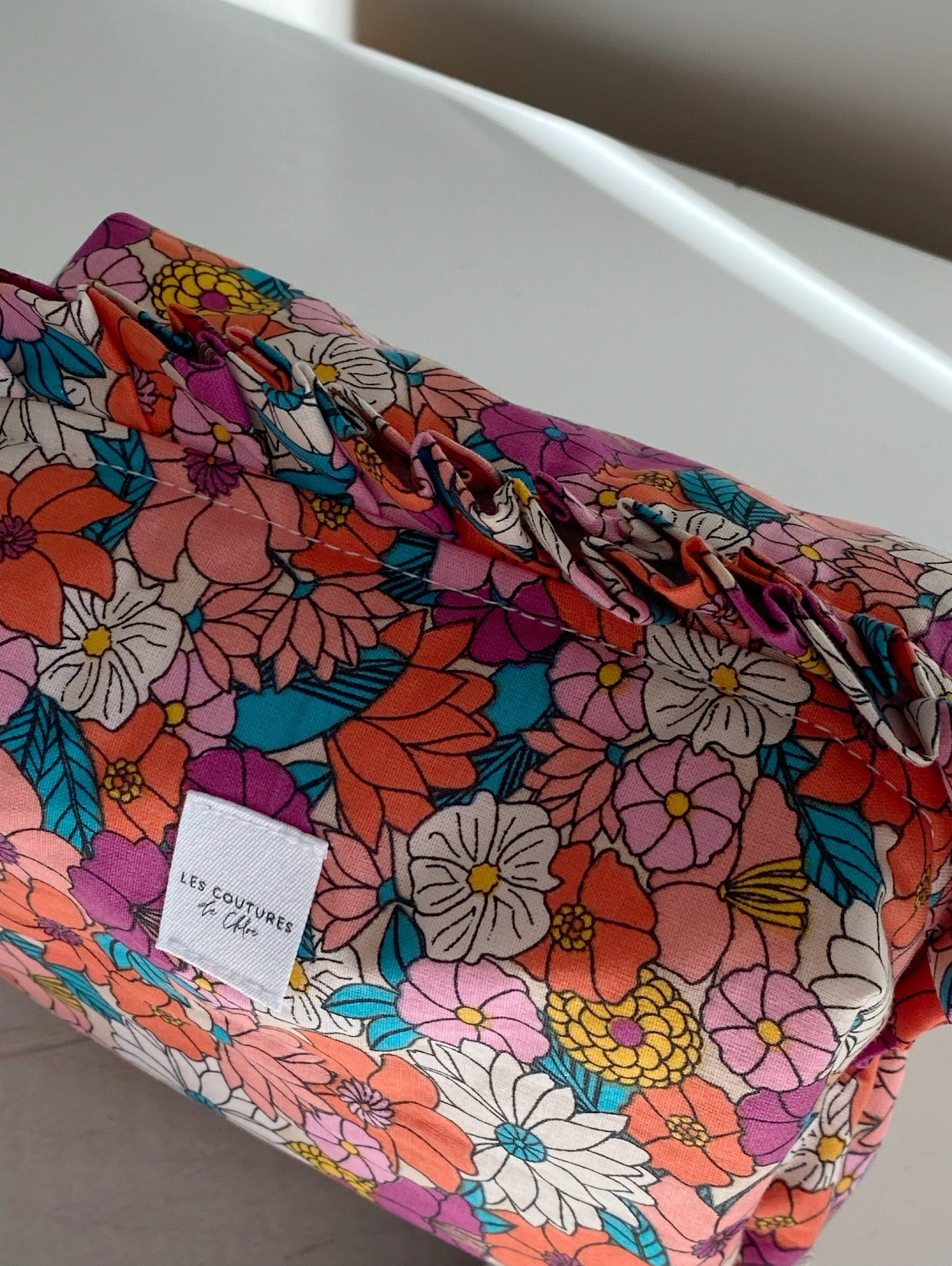 Trousse de toilette à volants