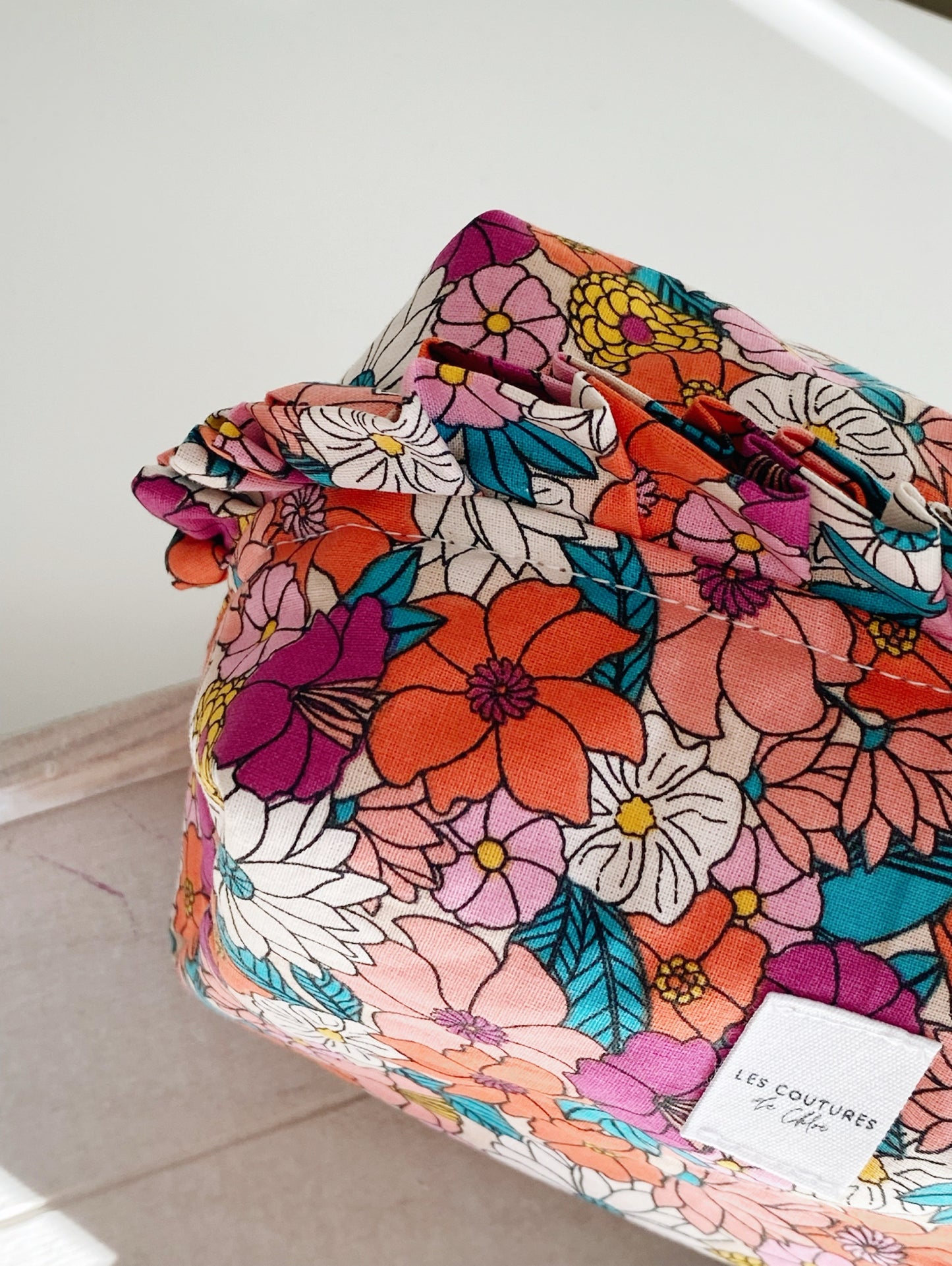 Trousse de toilette à volants